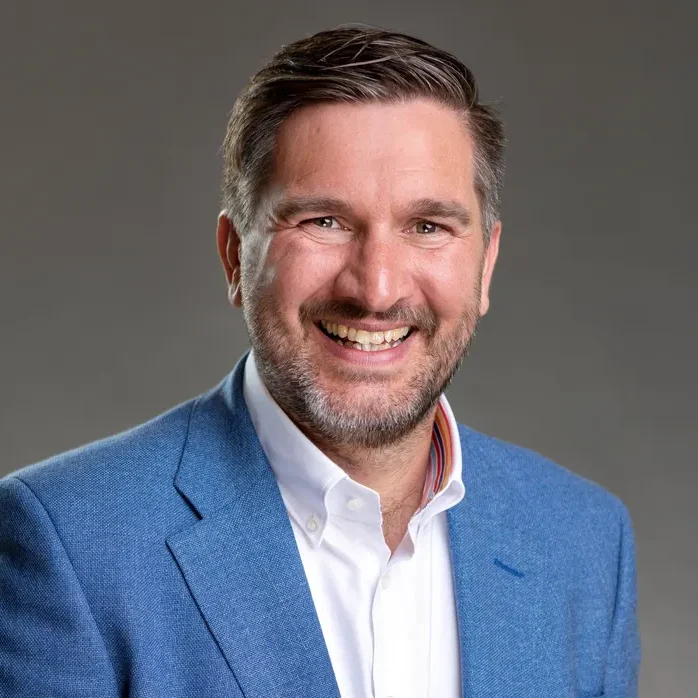 Smiling man in blue blazer portrait