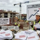 Hard-hatted construction worker at building site